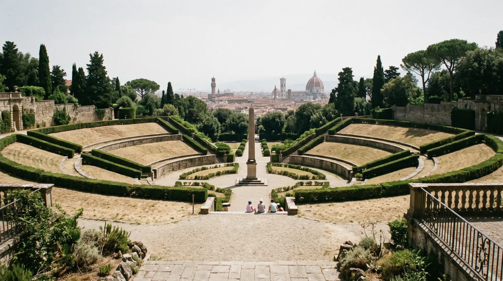 The grass amphitheatre and Egyptian obelisk seen from the upper terrace with the Florence skyline beyond, Boboli Gardens Florence