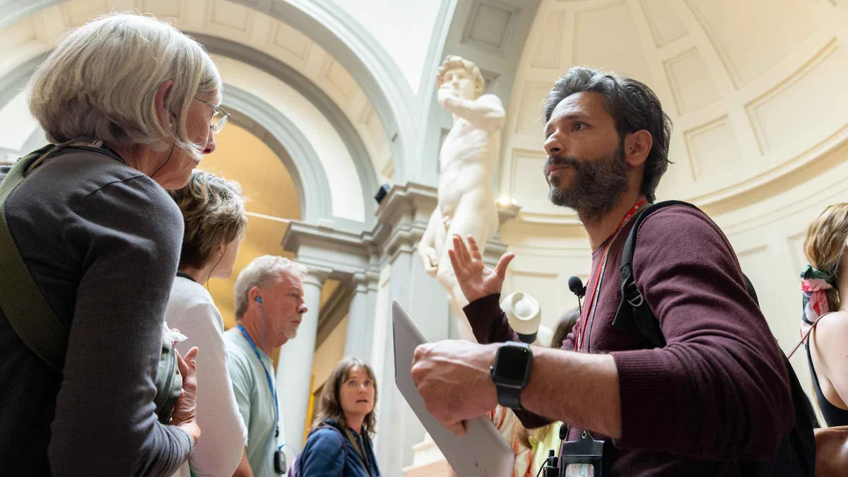 Guide explaining Michelangelo's David on an Accademia Gallery guided tour