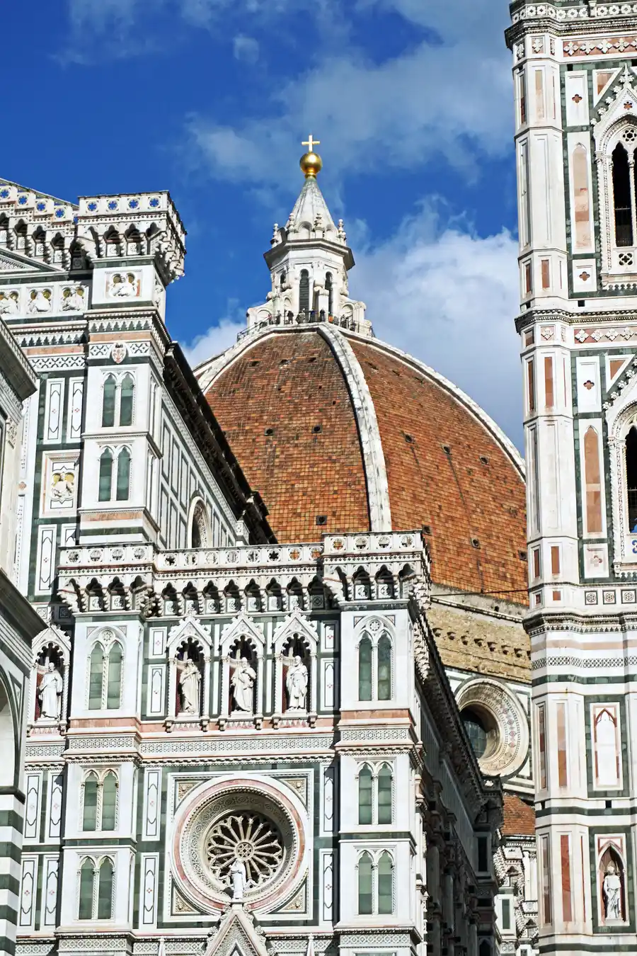 Brunelleschi's dome and Giotto's bell tower rising over the marble facade of Florence Cathedral