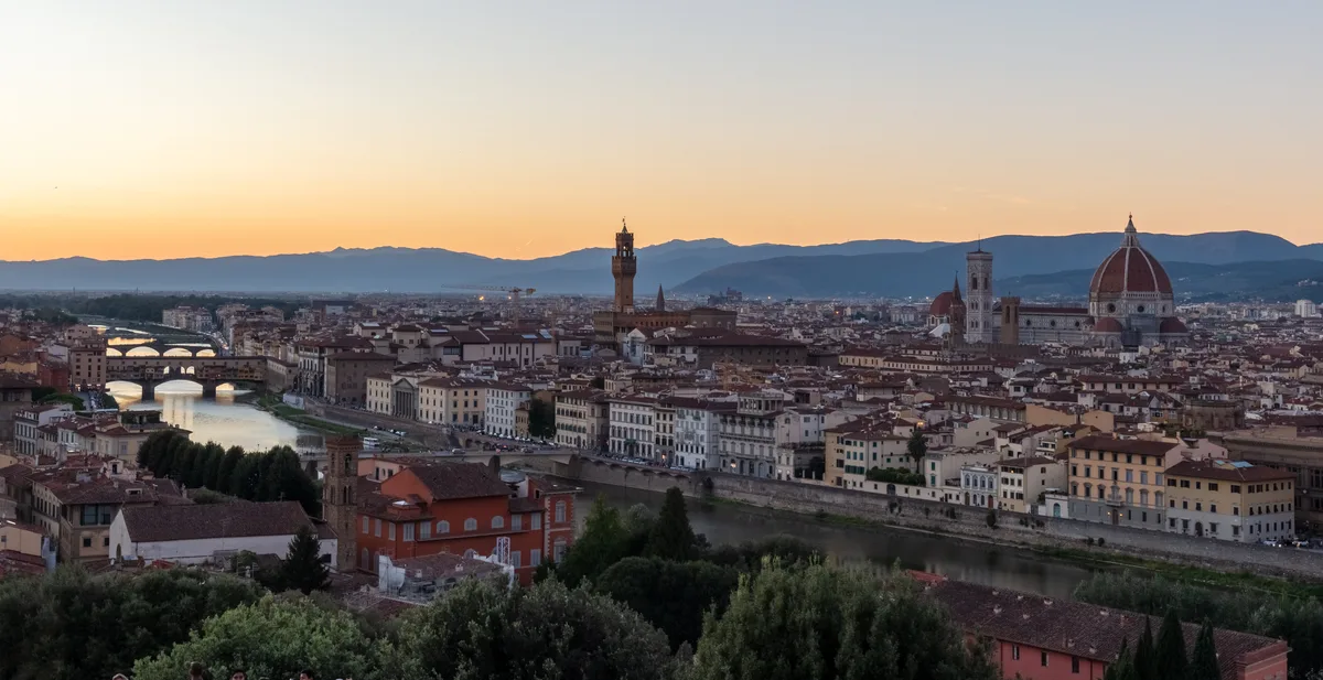 Sunset over Florence from Piazzale Michelangelo, with Ponte Vecchio, the tower of Palazzo Vecchio and the Duomo along the skyline