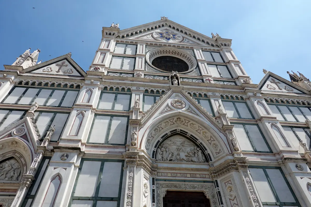 The nineteenth-century marble facade of the Basilica of Santa Croce seen from the piazza