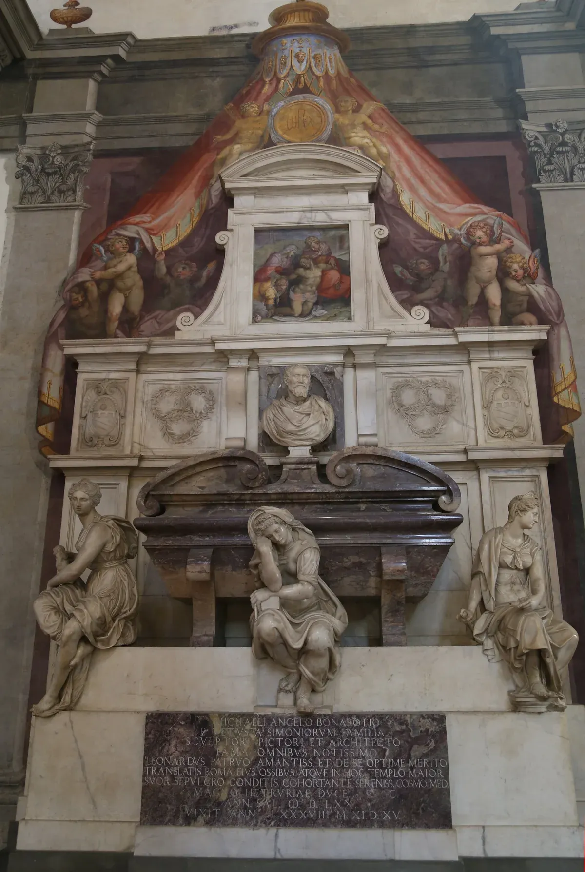 Vasari's tomb of Michelangelo on the right-hand wall of the Basilica of Santa Croce, Florence, with its three seated marble figures